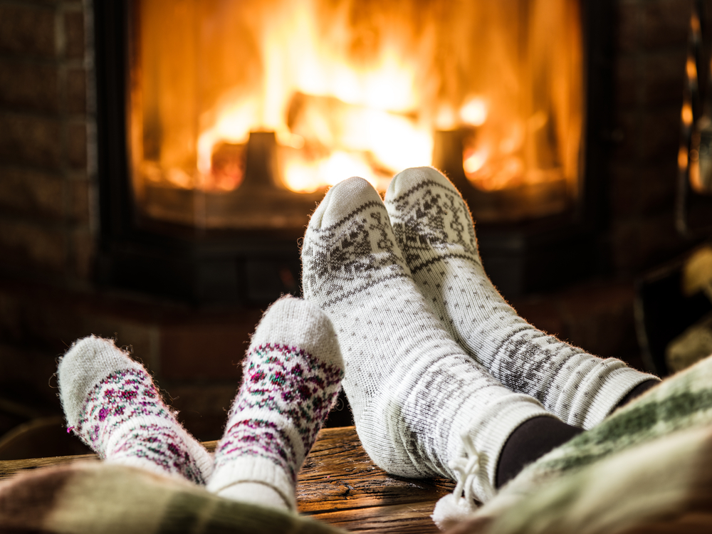 Warming feet near fireplace