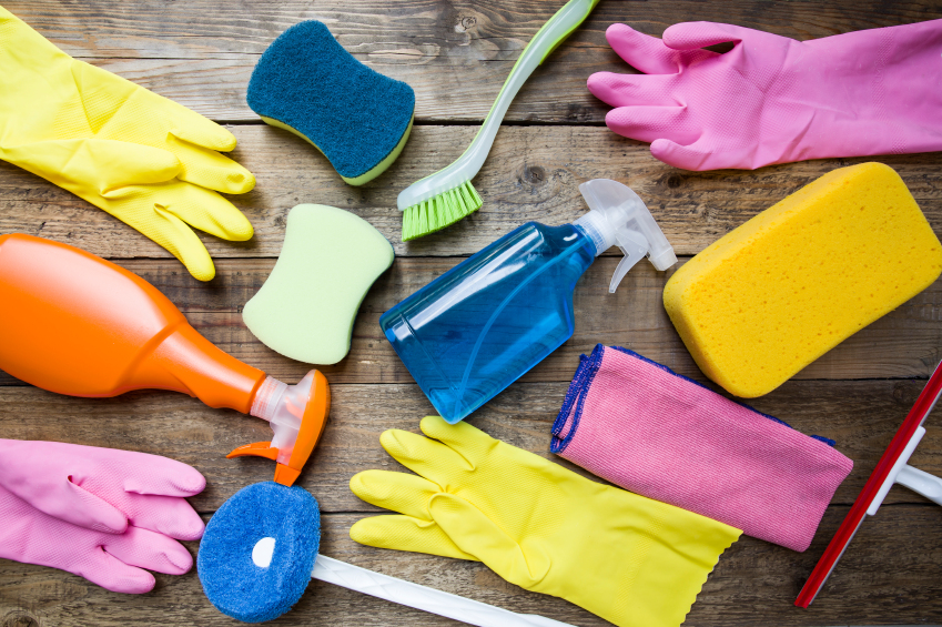 cleaning supplies on wooden floor